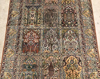 May include: A traditional Persian rug with a colourful floral pattern. The rug is made of wool and has a fringed border.
