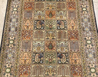 May include: A traditional Persian rug with a cream background and intricate floral and geometric patterns in shades of brown, green, and black. The rug features a central medallion with a repeating pattern of squares and rectangles.