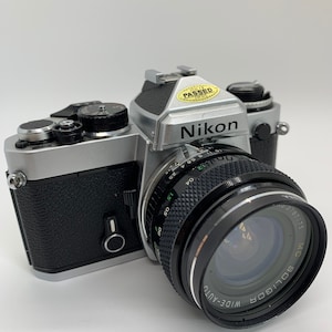 Nikon FE with 28mm f/2.5 Soligor Wide-Auto Lens and 52mm Tiffen Haze-1 Filter and a Nikon Flash