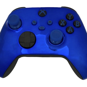 May include: A blue Xbox controller with black buttons and a blue and black d-pad. The controller has a glossy finish.
