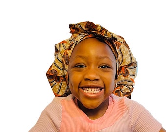 Gorro de dormir Ankara para niños: gorro de dormir marrón con forro de satén y banda ajustable para la cabeza.