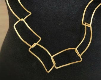 Statement gold necklace.