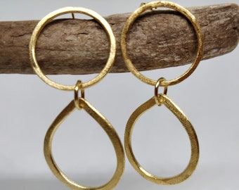 Statement gold earrings.