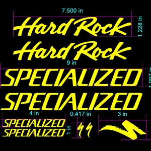 May include: Yellow vinyl decal set for a bicycle. The set includes two "Hard Rock" decals, two "Specialized" decals, and two smaller "Specialized" decals with the iconic S logo. The decals are approximately 7.5 inches wide and 1.25 inches tall.
