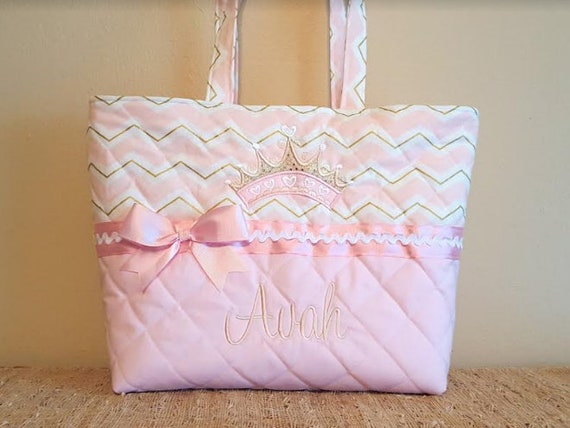 pink and gold diaper bag