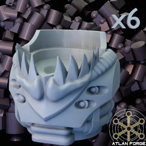 May include: A light gray, 3D-printed object with a futuristic, mechanical design. It features sharp, triangular spikes, multiple circular eye-like details, and a textured, ribbed section. The number "x6" is visible in the upper right corner. The object is likely a component or part.