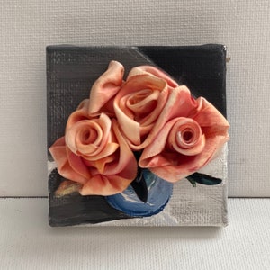 Orange Roses in a Blue Cup