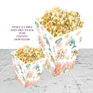 May include: Two white popcorn tubs filled with popcorn, decorated with watercolor sea creatures like dolphins, octopuses, and jellyfish. The text on the image reads: SMALL & LARGE POPCORN-SNACK TUBS INSTANT DOWNLOAD.