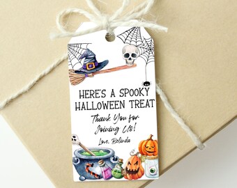 May include: A white Halloween gift tag tied with twine. The tag features a witch's hat, broom, skull, spiderweb, and cauldron illustrations. Text reads "HERE'S A SPOOKY HALLOWEEN TREAT, Thank You for Joining Us! Love, Belinda."