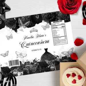 May include: Black and white Quincea&ntilde;era party favour wrapper with a black and white floral design, butterflies, and a crown. The wrapper says "Amelia Marie's Quincea&ntilde;era" and "September 2nd, 2024".