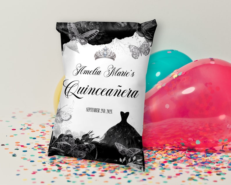 May include: A white and black party favour bag with a black and white butterfly design. The bag has the text "Amelia Marie's Quincea&ntilde;era" and "September 2nd, 2021".