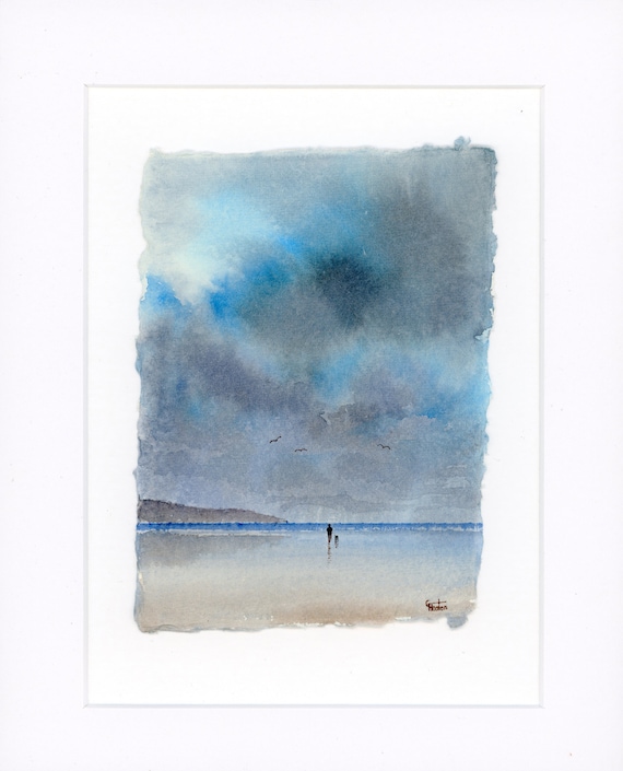 Original mounted deckled edged watercolour beach painting on handmade paper, Lligwy, Anglesey, figure and dog on stormy beach. Art gift UK