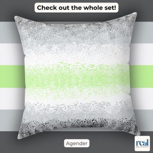 May include: A square pillow with a design featuring horizontal bands of gray, white, and green. The pillow has the text "Check out the whole set!" at the top and "Agender" at the bottom.