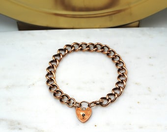 Vintage 9ct rose gold charm bracelet with heart padlock