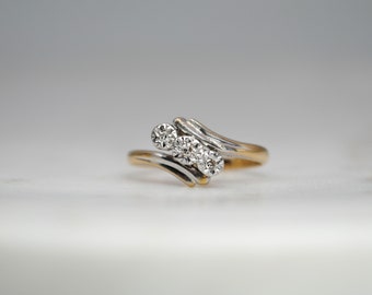 Vintage 18ct platinum and diamond cross over ring