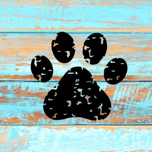 May include: Black paw print silhouette on a blue and brown wood background.