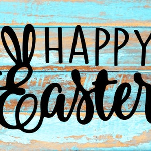 May include: Happy Easter greeting on a blue and brown wood background with a bunny ear design.
