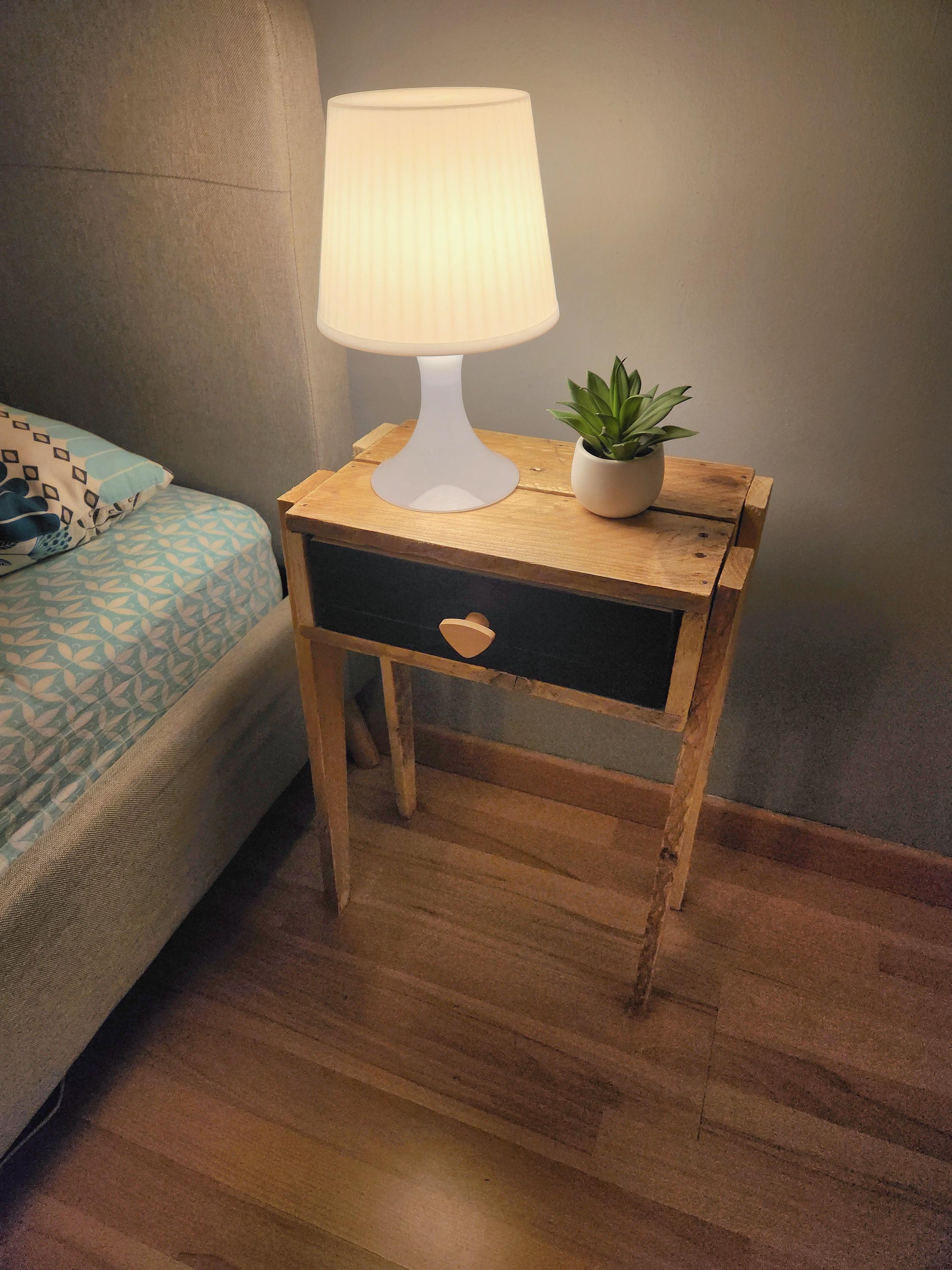 Pallet wood bedside table with black drawer and tapered legs