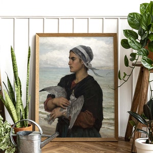 May include: A painting of a woman in a blue and white headscarf holding a white bird in her arms. The woman is wearing a dark brown dress and is standing in front of a body of water. The painting is set against a light blue sky with white clouds.