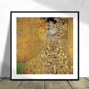 May include: A painting of a woman in a gold dress with a geometric pattern. The background is a gold and black mosaic.