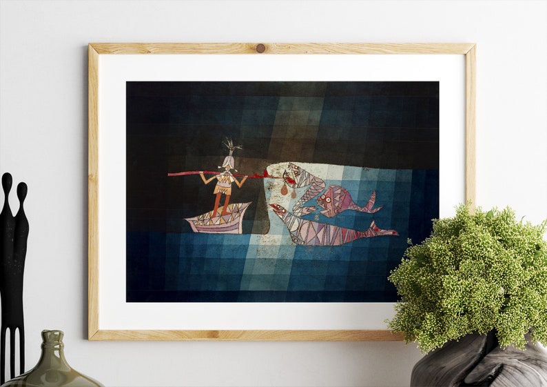 May include: A framed illustration of a person in a boat with a long stick, fishing for a group of fish with a geometric pattern. The background is a dark blue with a light blue grid pattern.