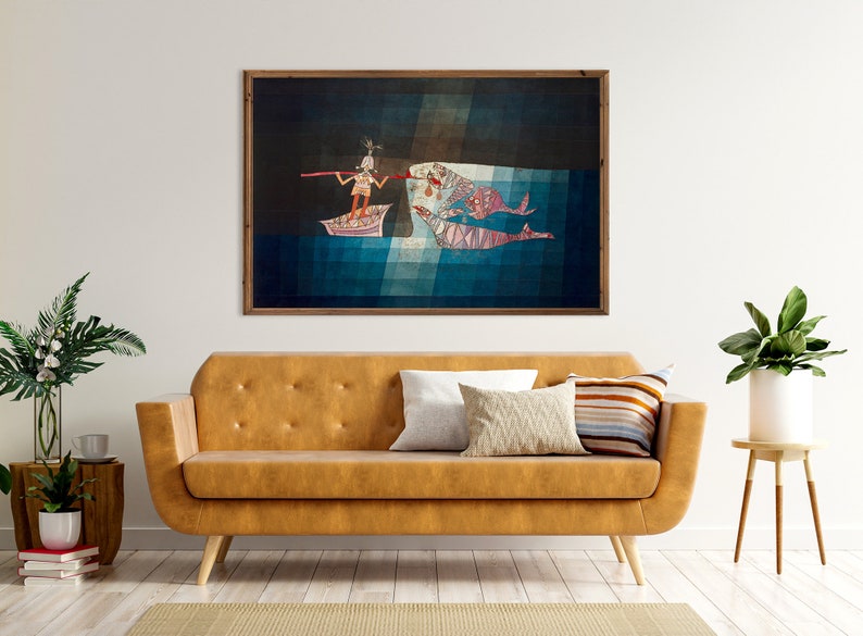 May include: A framed abstract painting depicting a person in a boat with a long pole, reaching towards two large fish in the water. The painting is set against a dark blue background with a light blue and white geometric pattern.