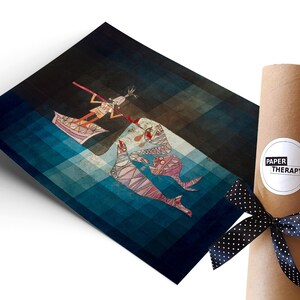 May include: A blue and brown abstract art print featuring a stylized figure in a boat with two fish-like creatures. The print is rolled up and tied with a black ribbon with white polka dots. The ribbon has a white label with the text "PAPER THERAPY".
