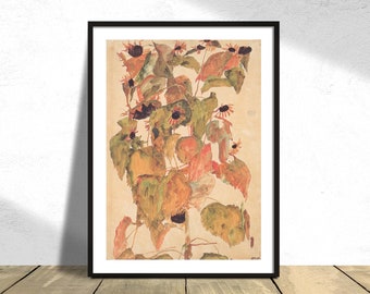 May include: A framed watercolor painting of sunflowers. The artwork features a cluster of sunflowers with green, orange, and brown leaves and petals. The painting is set against a beige background and framed in a black frame.