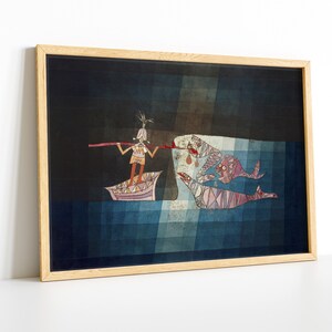 May include: A framed print of a surrealist painting depicting a person in a boat with a long stick, fishing for three fish in a dark blue sea. The fish are stylized and have a geometric pattern.