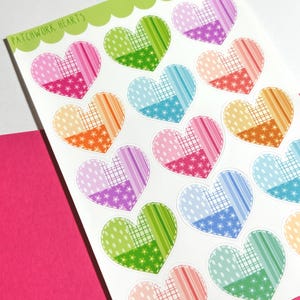 May include: Sheet of stickers featuring patchwork hearts in various colors and patterns. Each heart is divided into two sections with different designs, including polka dots, stripes, and stars. The text "Patchwork Hearts" is at the top.