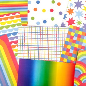 May include: A collection of colorful patterned papers. Designs include rainbow stripes, polka dots, plaid, and star patterns. The papers feature a vibrant palette of colors, including red, orange, yellow, green, blue, and purple.