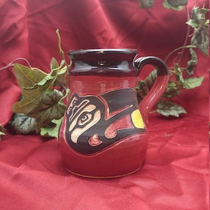 Raven Apporte la tasse de voyage Sun