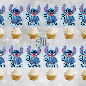 May include: Twelve blue and white cupcake toppers featuring Stitch from Lilo & Stitch. Each topper has the number 3 and the name Oliver.