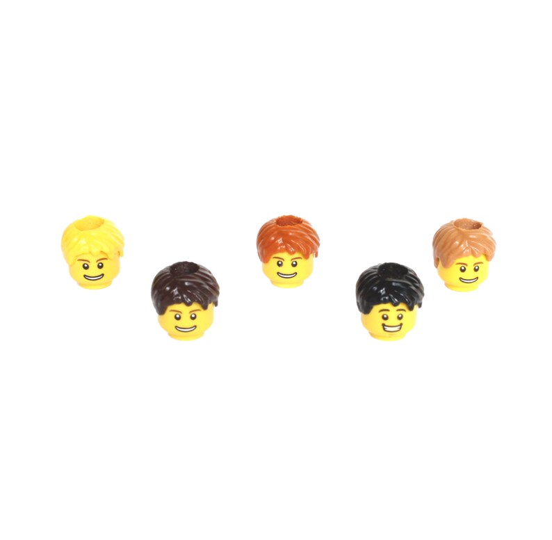 May include: Five Lego minifigure heads with different hairstyles. The heads are yellow with black eyes and smiling mouths. The hairstyles are blonde, brown, black, and two different shades of brown.