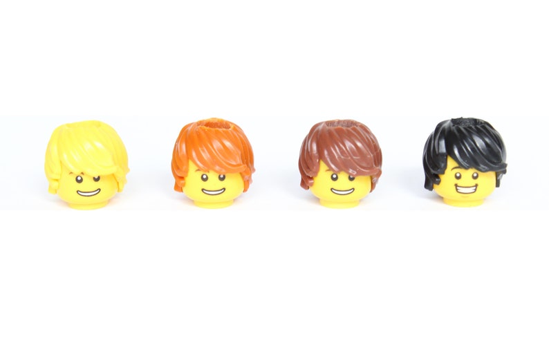 May include: Four Lego minifigure heads with different hair colors: yellow, orange, brown, and black. Each head has a yellow face with a smiling expression.