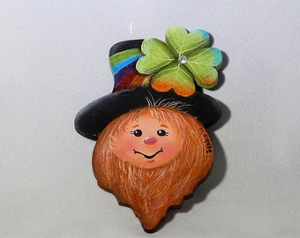 Hand painted Leprechaun Pin, 3 inches by 2 inches, adorned with a shamrock, rainbow hatband and swarovski crystal.  Wearing the green is fun