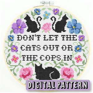 May include: A cross-stitch pattern featuring a floral wreath with black cats and the text "Don't let the cats out or the cops in." The pattern is labeled "Digital Pattern".