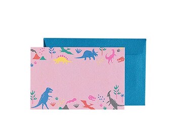 May include: Pink card with a blue envelope. The card has a colorful dinosaur pattern with pink, blue, yellow, green, and red colors. The dinosaurs are surrounded by small green trees and red volcanoes.