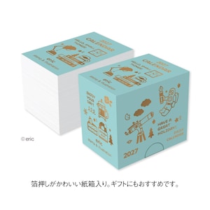 May include: A light blue 2027 daily calendar block with gold foil illustrations including an astronaut, telescope, and desk lamp. The text reads "HELLO, SMALL THINGS!", "ENJOY YOUR DAY!", "HAVE A GREAT HOLIDAY!", "eric stamp & illustration", and "2027".