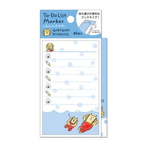May include: A blue and white to-do list notepad with a cartoon cat illustration. The notepad has 45 sheets and is labeled "To-Do List Marker" and "Gorogoro Nyansuke".