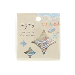 May include: A pack of clear flake seals with a beach theme. The pack is white with a light brown background and features a blue and white seashell design. The text on the pack reads "キキララ Clear flake seal".