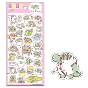 May include: A sheet of stickers featuring a cartoon crocodile in various poses. The crocodile is wearing different outfits and accessories, including a chef's hat, a swimsuit, and a bathrobe. The stickers are on a pink background with Japanese text that says "Baby Crocodile Stickers".