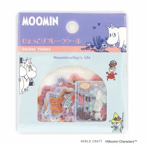 May include: A package of Moomin sticker flakes featuring characters from the Moominvalley's Life series. The stickers are transparent and feature various scenes from the Moominvalley world. The package is purple and blue with the Moomin logo and the text "Sticker Flakes" and "Moominvalley's Life".