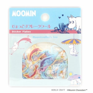 May include: A pack of Moomin sticker flakes featuring characters from Moominvalley's Sea. The stickers are colourful and feature various Moomin characters, including Moomintroll, Sniff, and Little My. The pack is blue and white with the text "Moomin" and "Sticker Flakes" in large, bold letters.