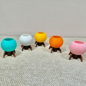 May include: A white ceramic mug with a black handle and the text "But First, Coffee" in a handwritten style. The mug is likely 11-15 ounces and suitable for hot beverages.