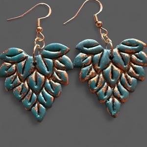 Blue and copper colored leaf earrings. Perfect for jeans and sweater weather. Handcrafted boho earrings made from lightweight polymer clay.
