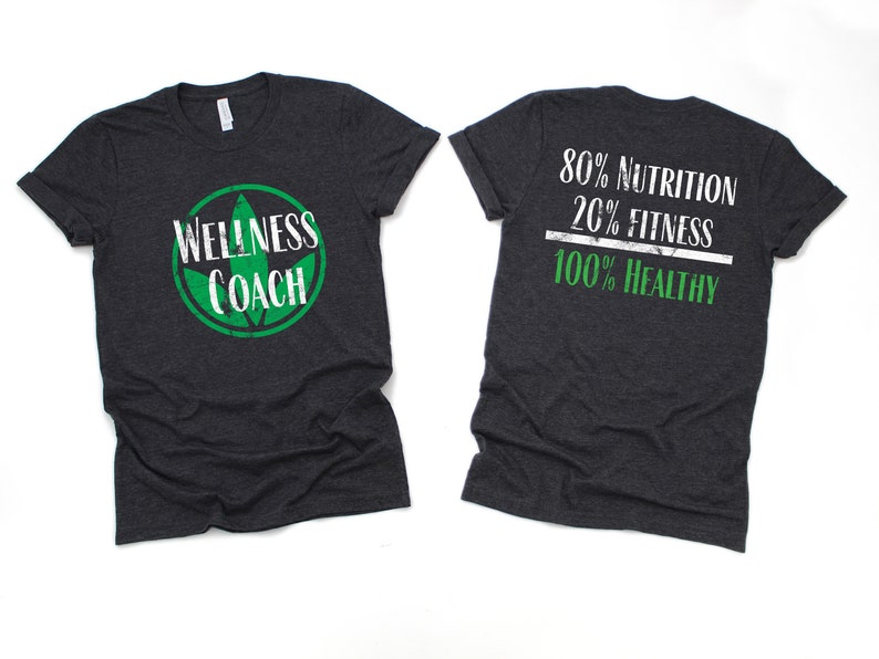 May include: A dark heather grey t-shirt with a green leaf logo and the text "Wellness Coach" on the front. The back of the shirt has the text "80% Nutrition 20% Fitness 100% Healthy" in white with a green line.