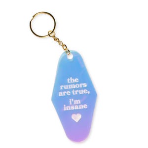 May include: A blue and purple motel key chain with the text "the rumors are true, i'm insane" and a small heart.