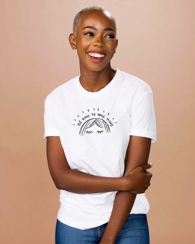 May include: White t-shirt with a black graphic that says "Be kind to your mind" with a stylized drawing of a woman's face with closed eyes.