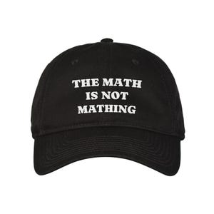 May include: Black baseball cap with white text that reads "THE MATH IS NOT MATHING".